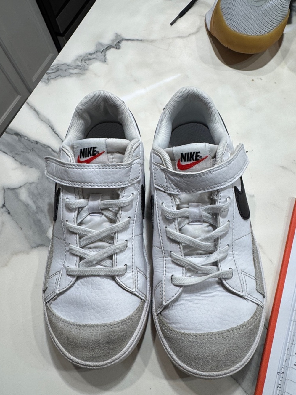 Nike Kids White Sneakers with Black Swoosh and Red Logo